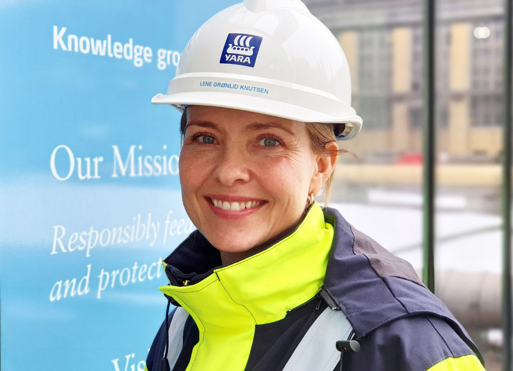 woman, portrait, posing, white helmet, outside building, industry