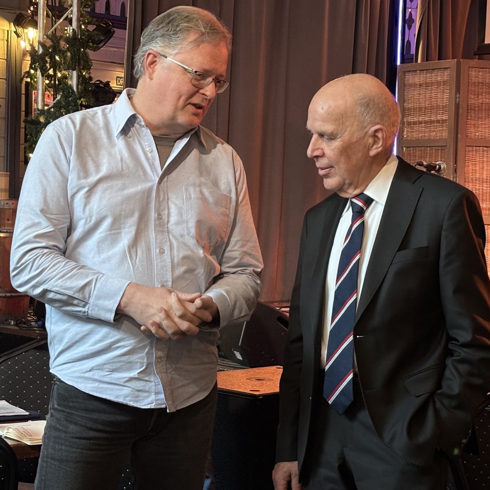 two men talking to each other