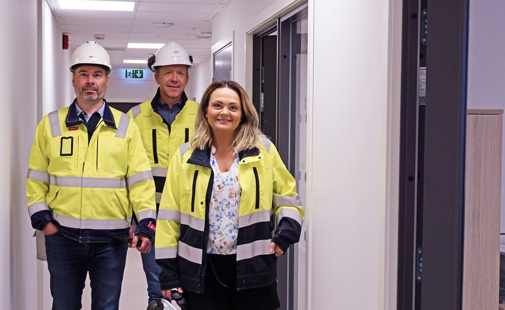 three people, posing, office premises corridor
