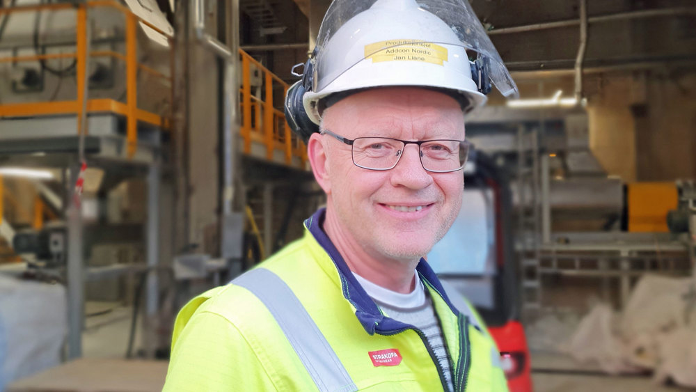 portrait of man in front of process facility