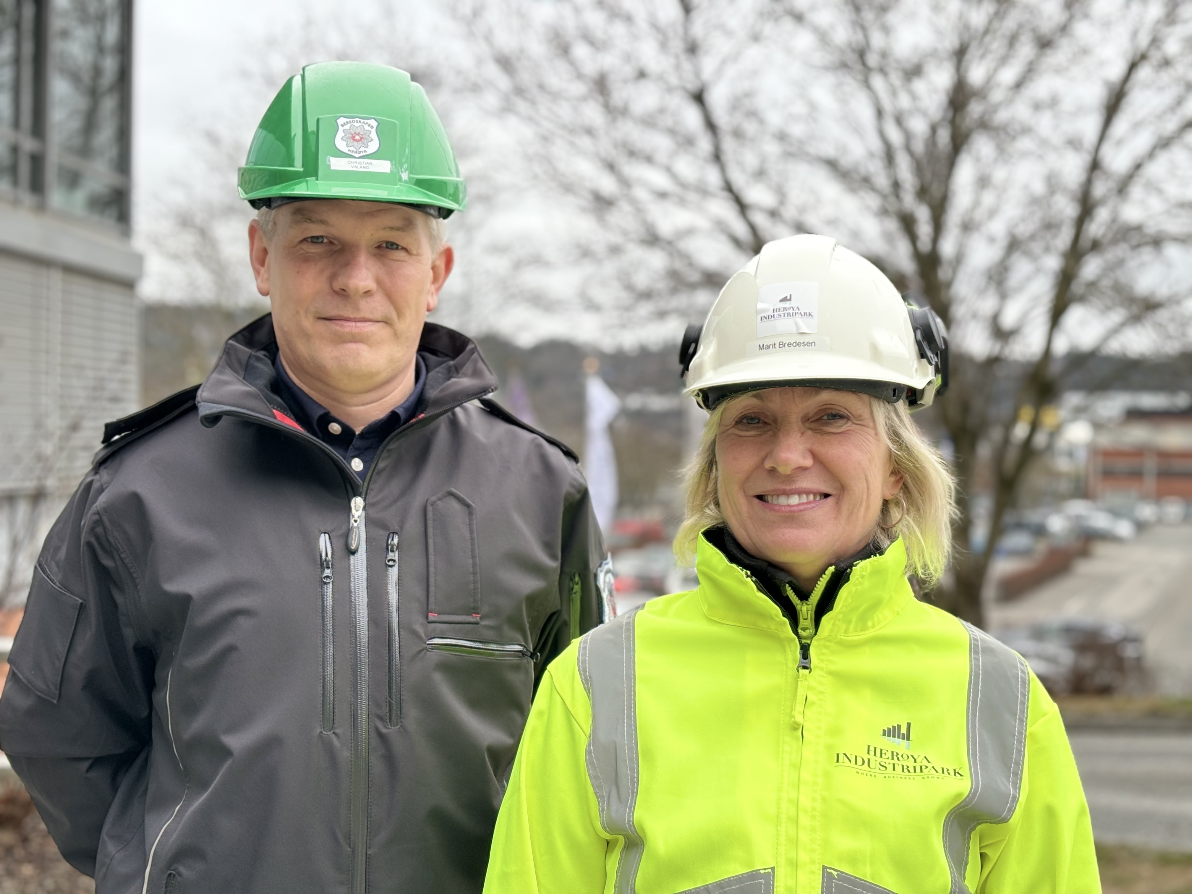 man and woman, portrait, posing, PPE, parking space in background